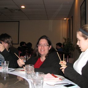 IMG_7714 Matthew texts while Becki and Sarah try to get the hang of the chop sticks