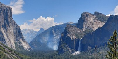 20230614_121343 Yosemite Valley. On the left - El Capitan. In the background - Half Dome. Center - some smoke from prescribed burns. On the right, Bridalveil Fall.