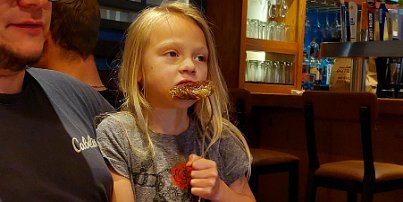 20240705_190358 Lennon eating her steak at Outback