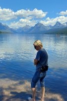 20240706_130139 Apgar - Lake McDonald - Natalie checks to see if the water is truely cold