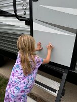 May 15 - Hands on prayer to protect camper during upcoming big storm Lennon places her hands on their camper and prays that the impending severe storms do no damage to it.